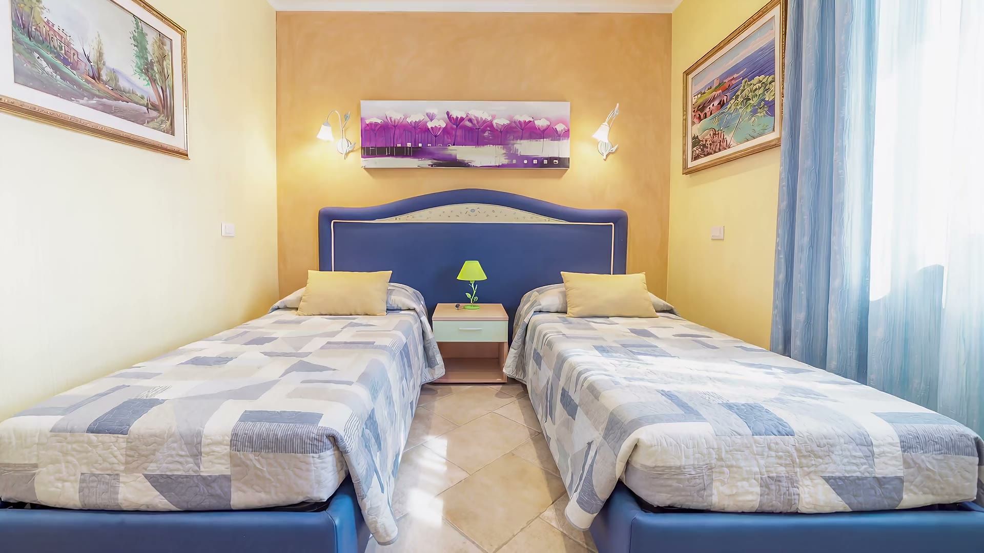 La camera con due letti singoli di Casa Pescoluse 8